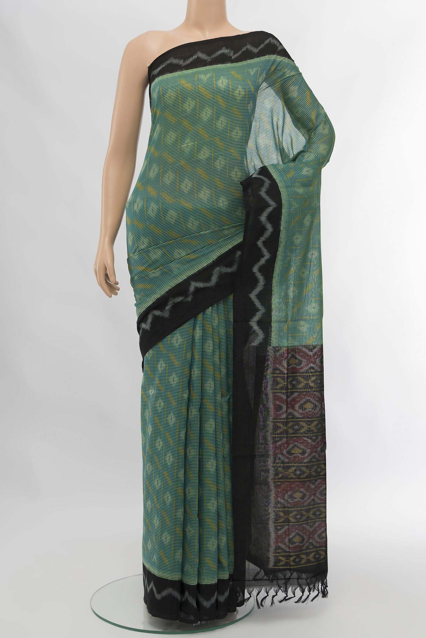 Blue Pochampally Cotton Saree with Pure Ikat on the body and Plain Border displayed on a mannequin