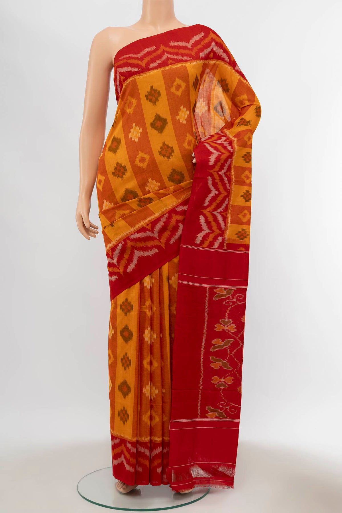 Mustard Pochampally Cotton Saree with Pure Ikat on the body and Plain Border displayed on a mannequin