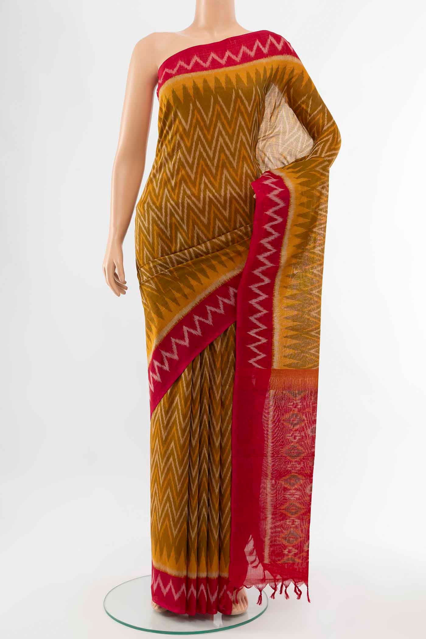 Mustard Pochampally Cotton Saree with Ikat Print on the body and Ikat Border displayed on a mannequin
