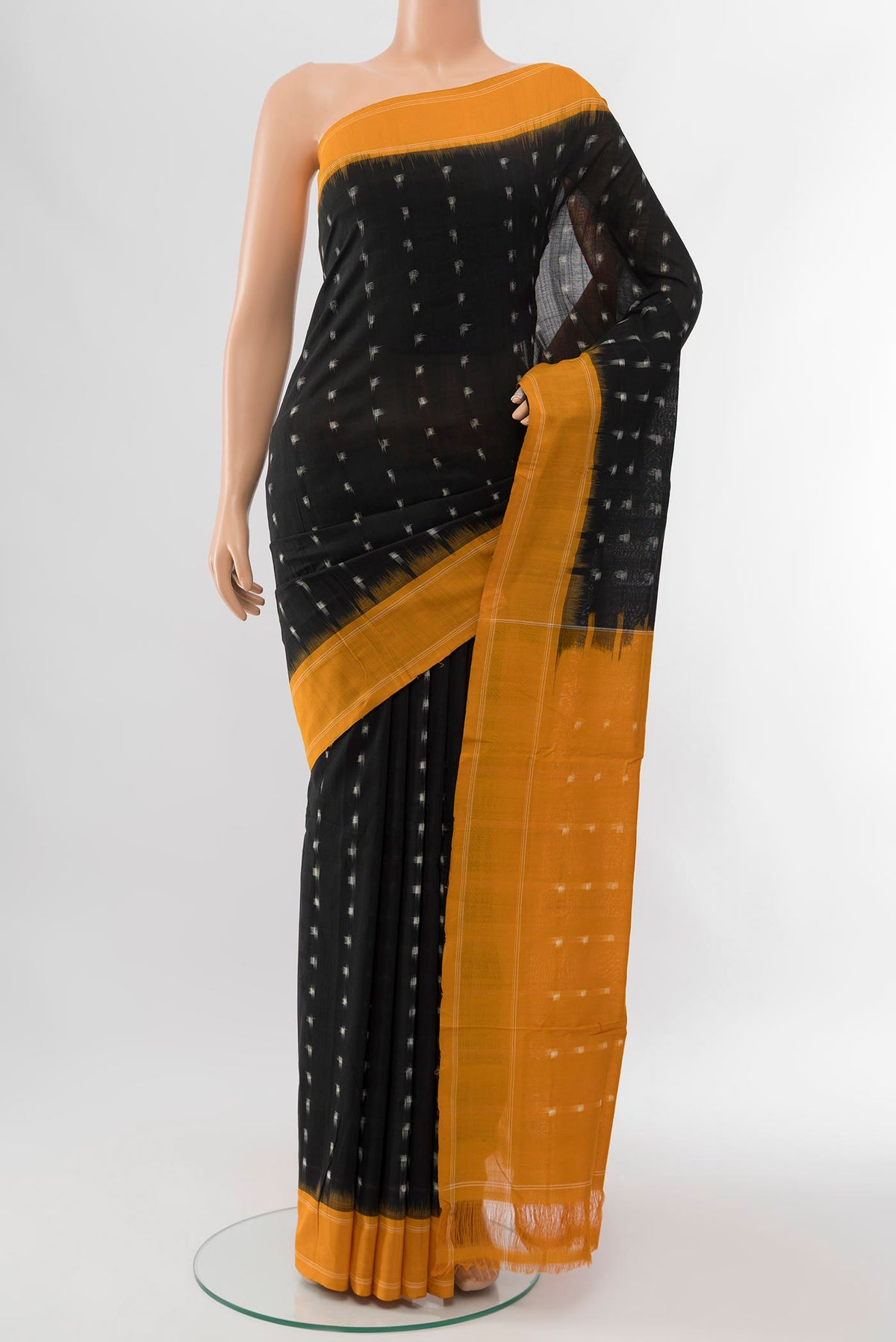 Black Cotton Saree with Pure Ikat on the body and Plain Border displayed on a mannequin