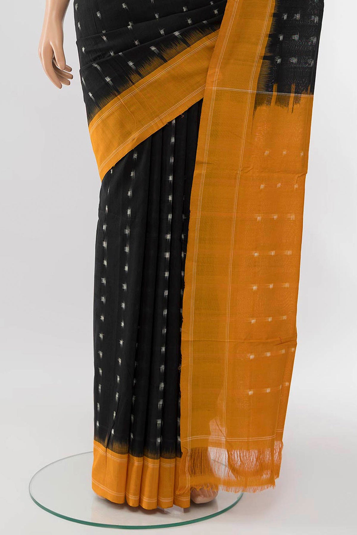 Pleats and pallu of Black Cotton Saree with Pure Ikat on the body and Plain Border