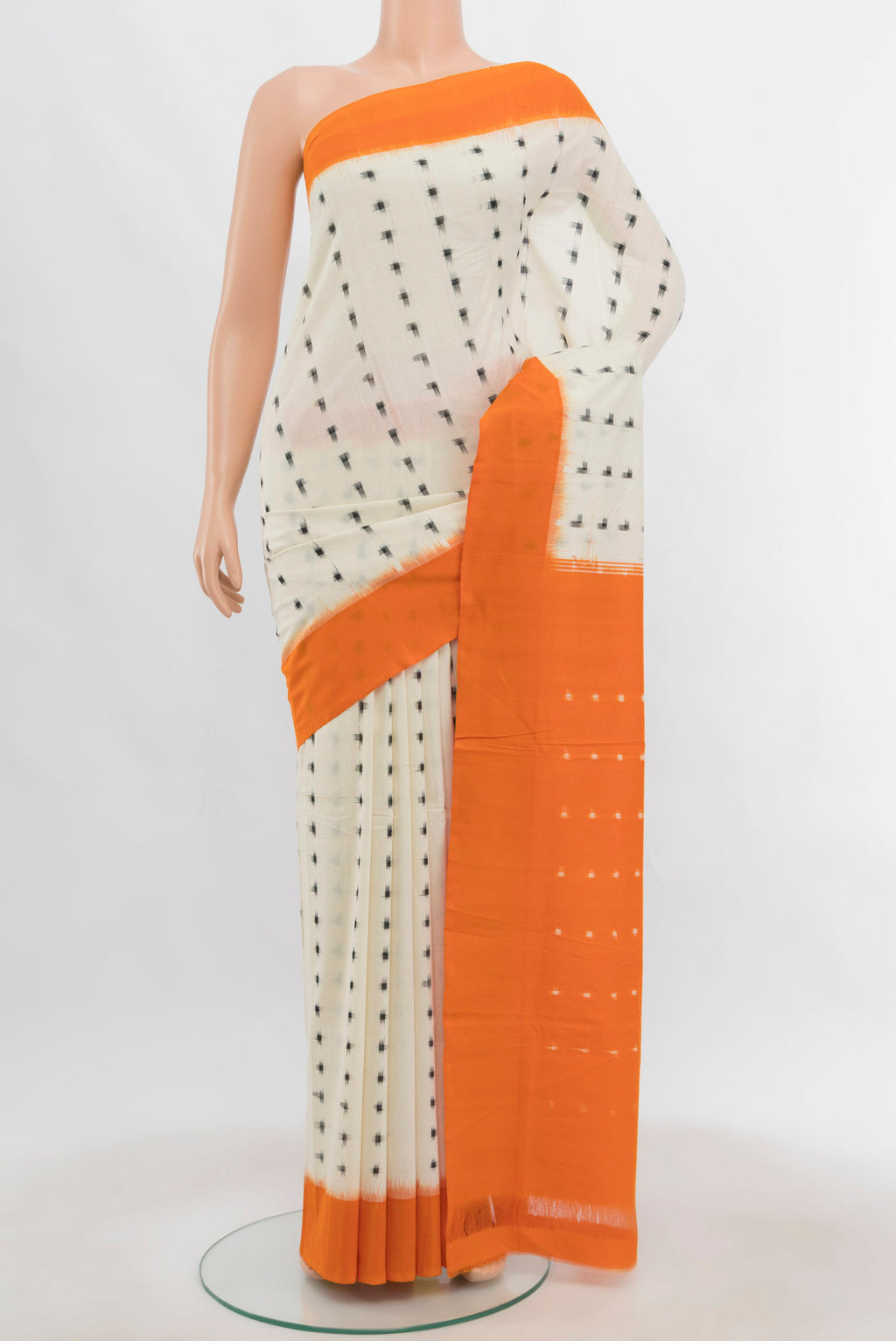 Cream Pochampally Cotton Saree with Ikat Print on the body and Ikat Border.  displayed on a mannequin