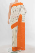Cream Pochampally Cotton Saree with Ikat Print on the body and Ikat Border.  displayed on a mannequin