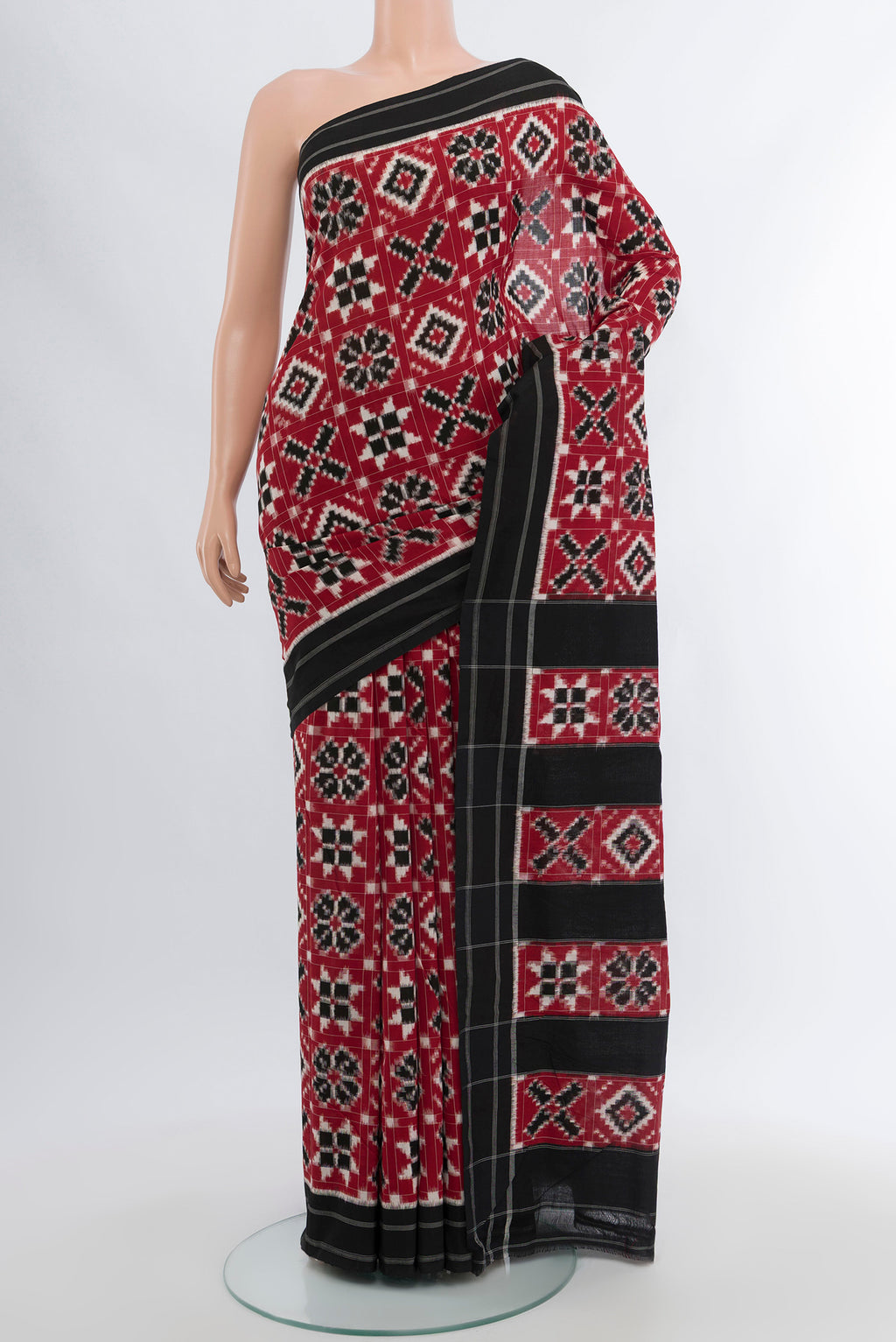 Multi Color Orissa Silk Saree with Ikat Print on the body and Silk Border.  displayed on a mannequin