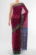 Magenta Kora Cotton Saree with Ikat Print on the body and Ikat Border displayed on a mannequin