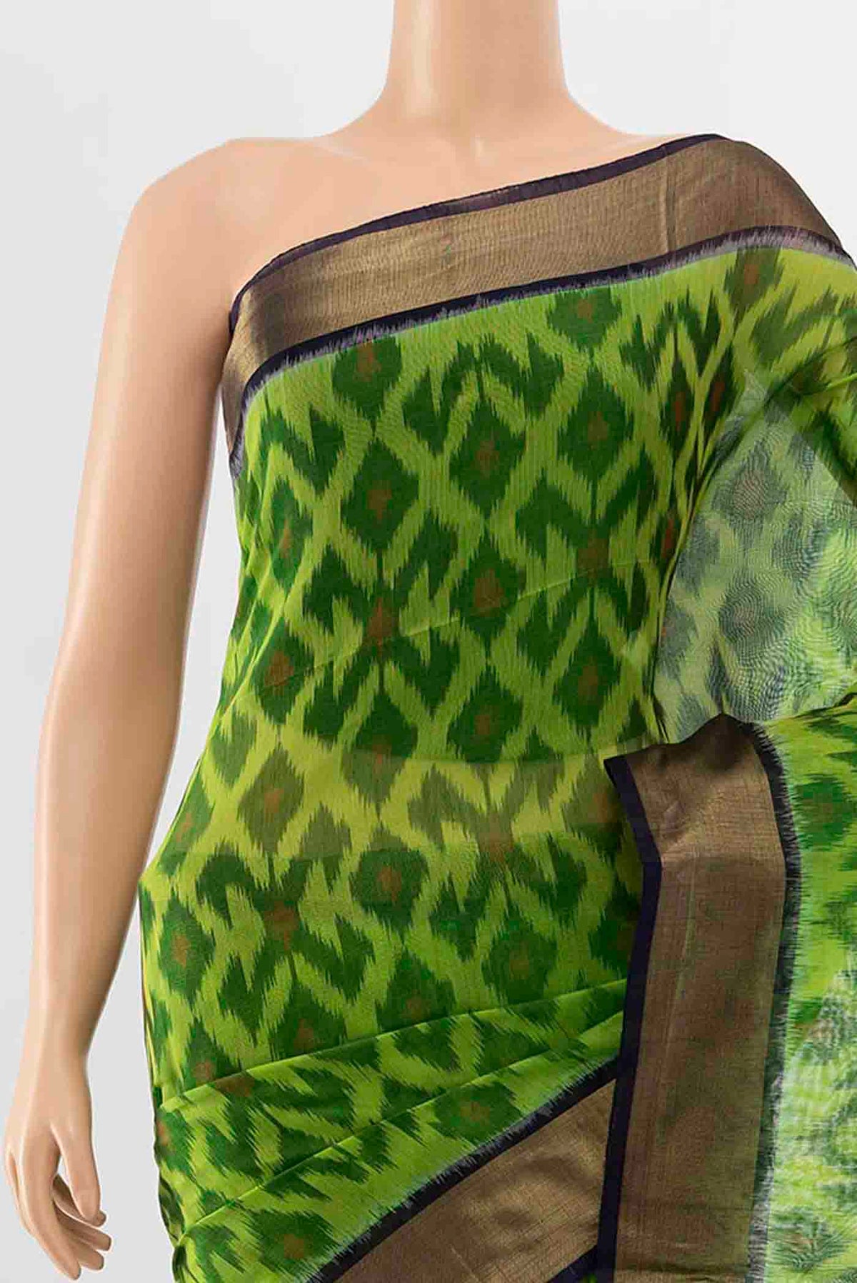 Border image of Parrot Green Kora Cotton Saree with Ikat Print on the body and Ikat Border