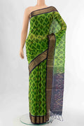 Parrot Green Kora Cotton Saree with Ikat Print on the body and Ikat Border displayed on a mannequin