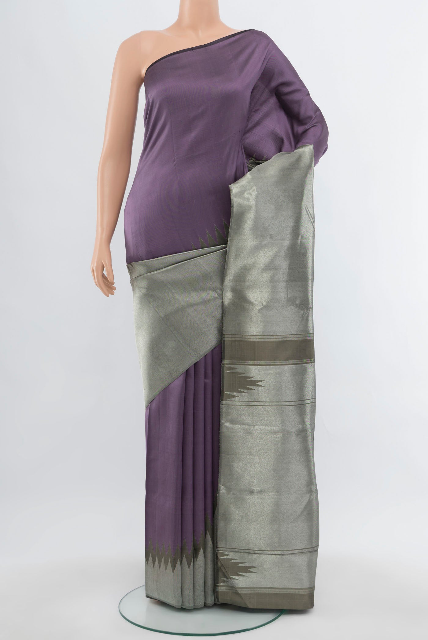 Grey Kanchipuram Silk Saree with Zari Butta on the body and Silk Border.  displayed on a mannequin