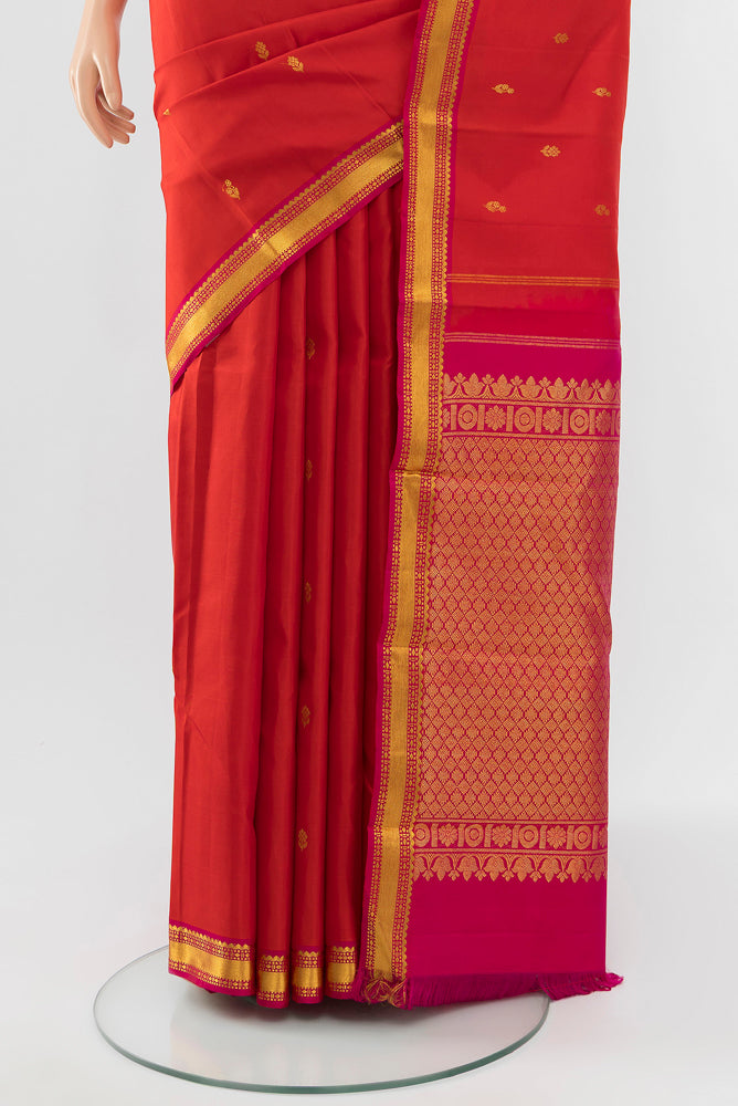 Pleats and pallu of Red Kanchipuram Silk Saree with Zari Butta on the body and Silk Border. 