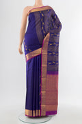 Navy Blue Kanjivaram Silk Saree with Zari Butta on the body and Silk Border.  displayed on a mannequin
