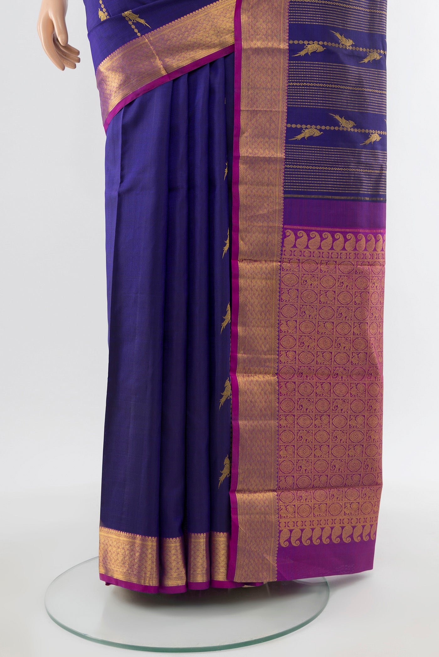 Pleats and pallu of Navy Blue Kanjivaram Silk Saree with Zari Butta on the body and Silk Border. 