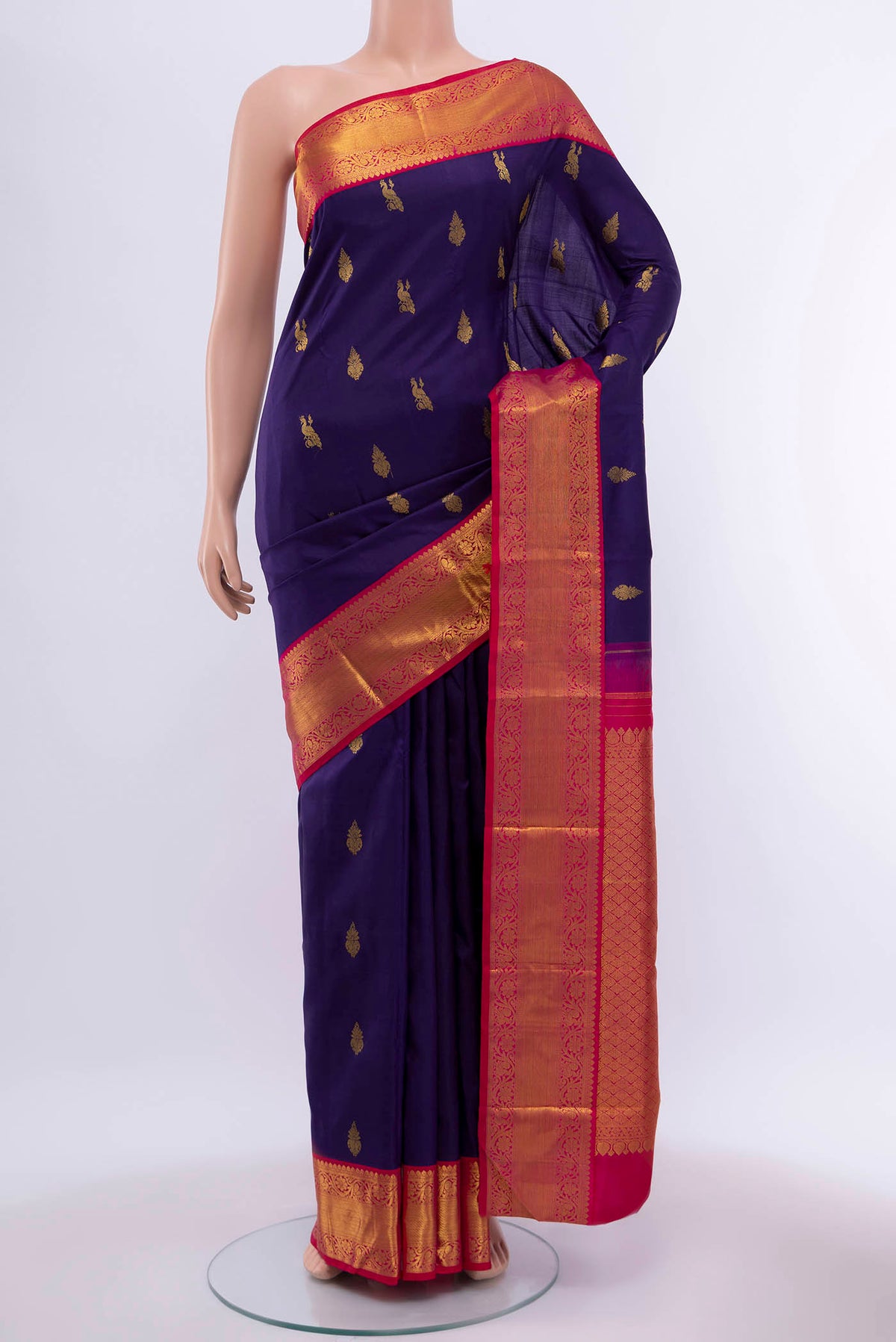 Navy Blue Kanchipuram Silk Saree with Zari Butta on the body and Zari Border displayed on a mannequin