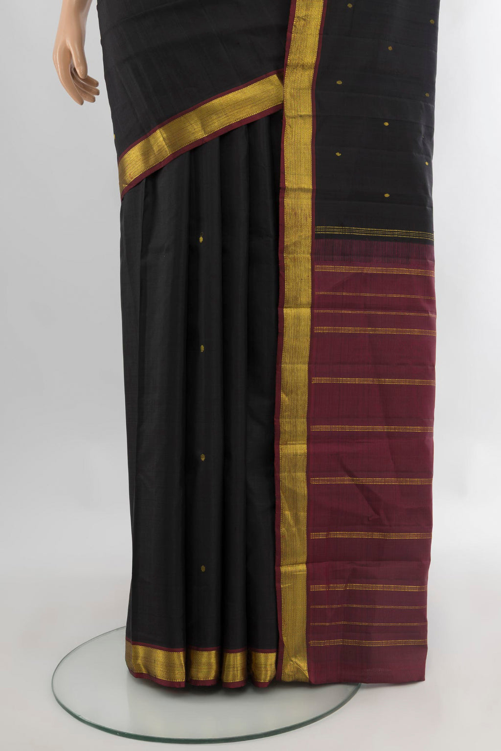 Pleats and pallu of Black Kanjivaram Silk Saree with Zari Butta on the body and Zari Border. 