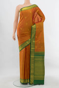 Pure Silk Pure Zari Rust Kanjivaram Saree with Zari Butta on the body and Silk Border.  displayed on a mannequin
