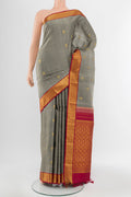 Davys Grey Kanjivaram Silk Saree with Zari Butta on the body and Silk Border.  displayed on a mannequin