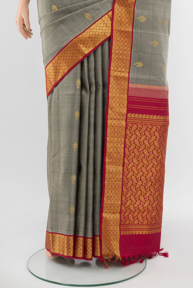 Pleats and pallu of Davys Grey Kanjivaram Silk Saree with Zari Butta on the body and Silk Border. 