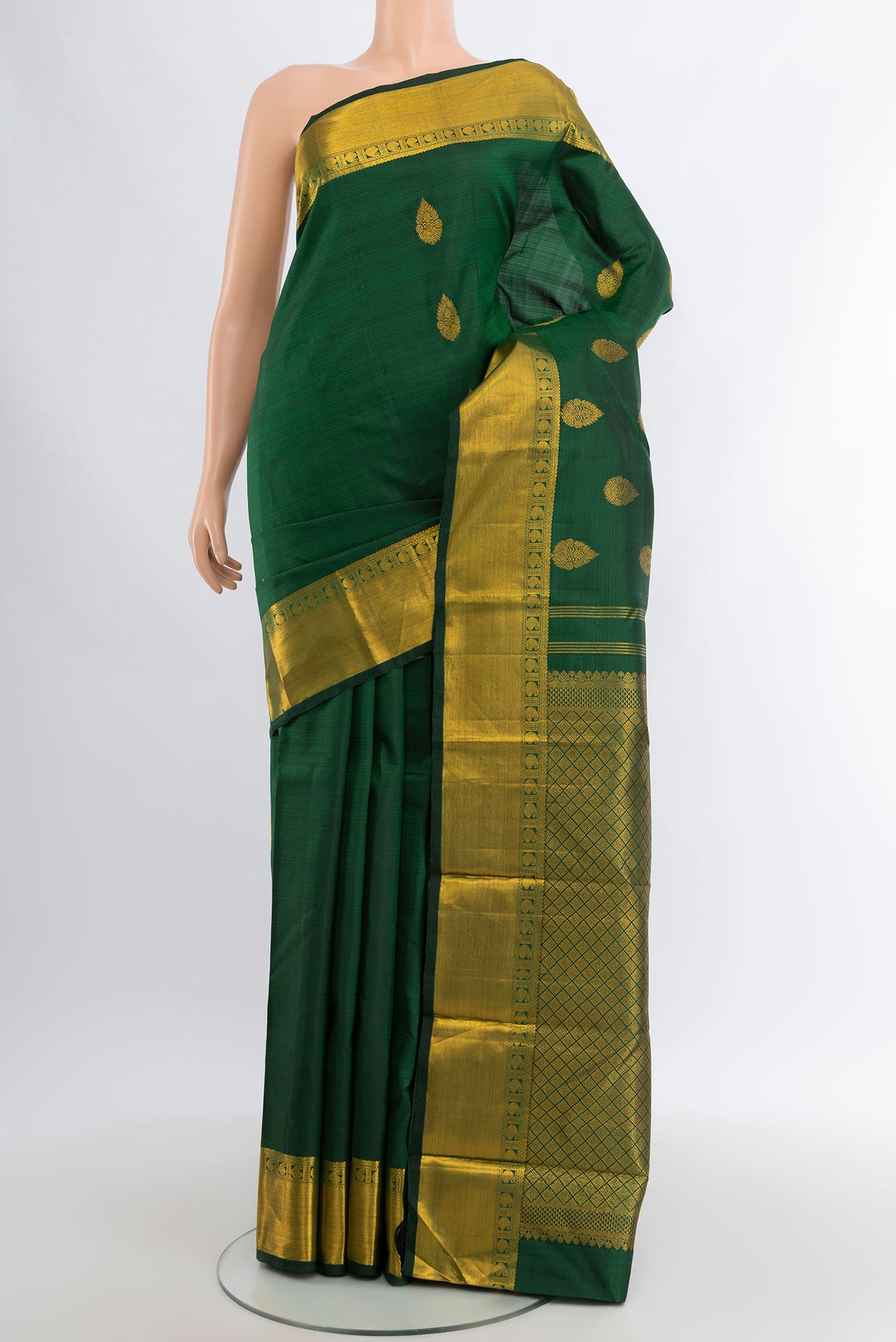 Bottle Green Kanjivaram Silk Saree with Zari Butta on the body and Zari Border.  displayed on a mannequin
