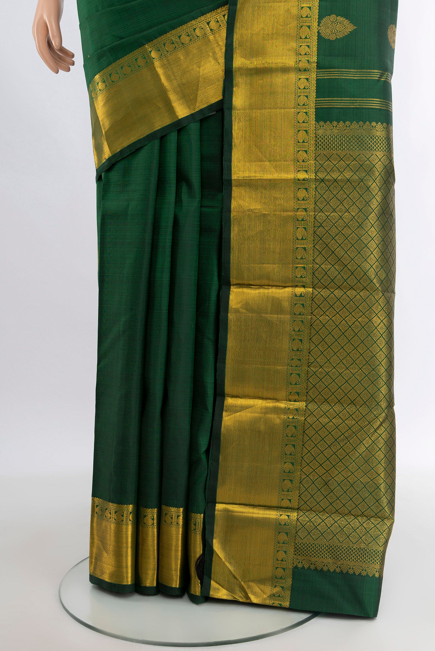 Pleats and pallu of Bottle Green Kanjivaram Silk Saree with Zari Butta on the body and Zari Border. 