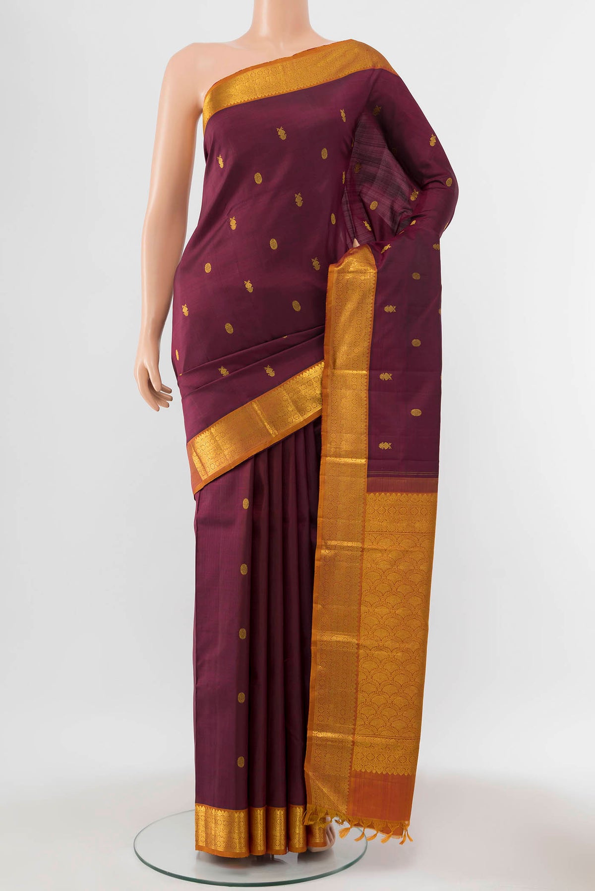Maroon Kanchipuram Silk Saree with Zari Butta on the body and Silk Border displayed on a mannequin