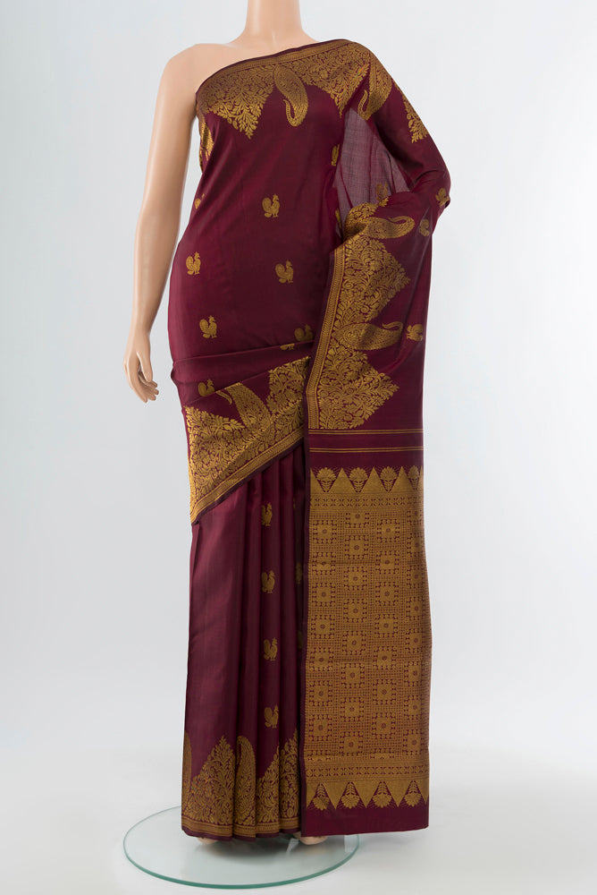Pure Silk Pure Zari Coffee Brown Kanjivaram Saree with Zari Butta on the body and Silk Border.  displayed on a mannequin