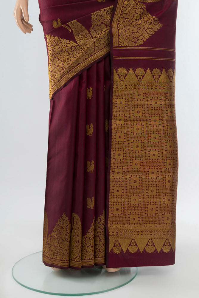 Pleats and pallu of Pure Silk Pure Zari Coffee Brown Kanjivaram Saree with Zari Butta on the body and Silk Border. 