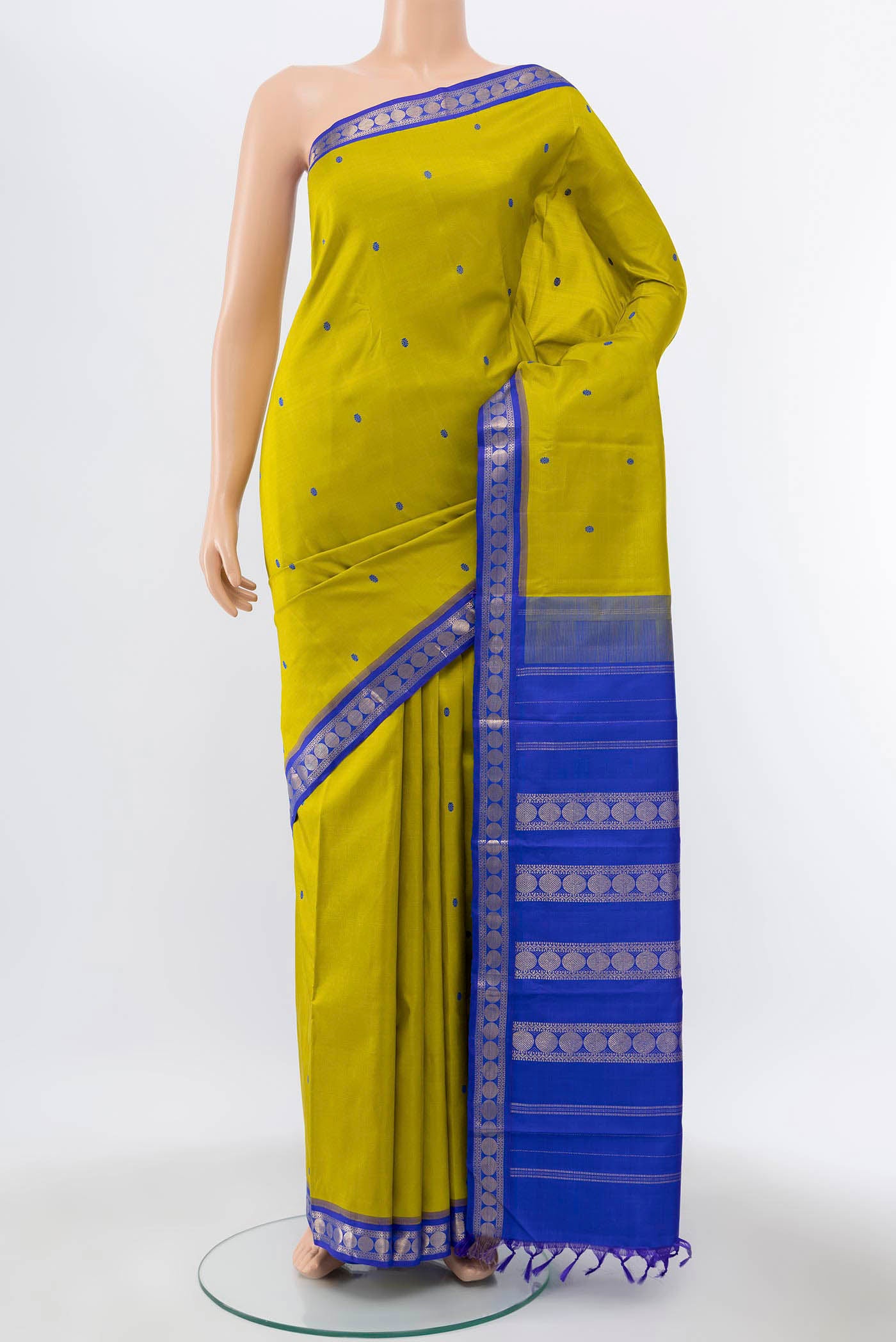 Acid Green Kanchipuram Silk Saree with Thread Butta on the body and Zari Border displayed on a mannequin