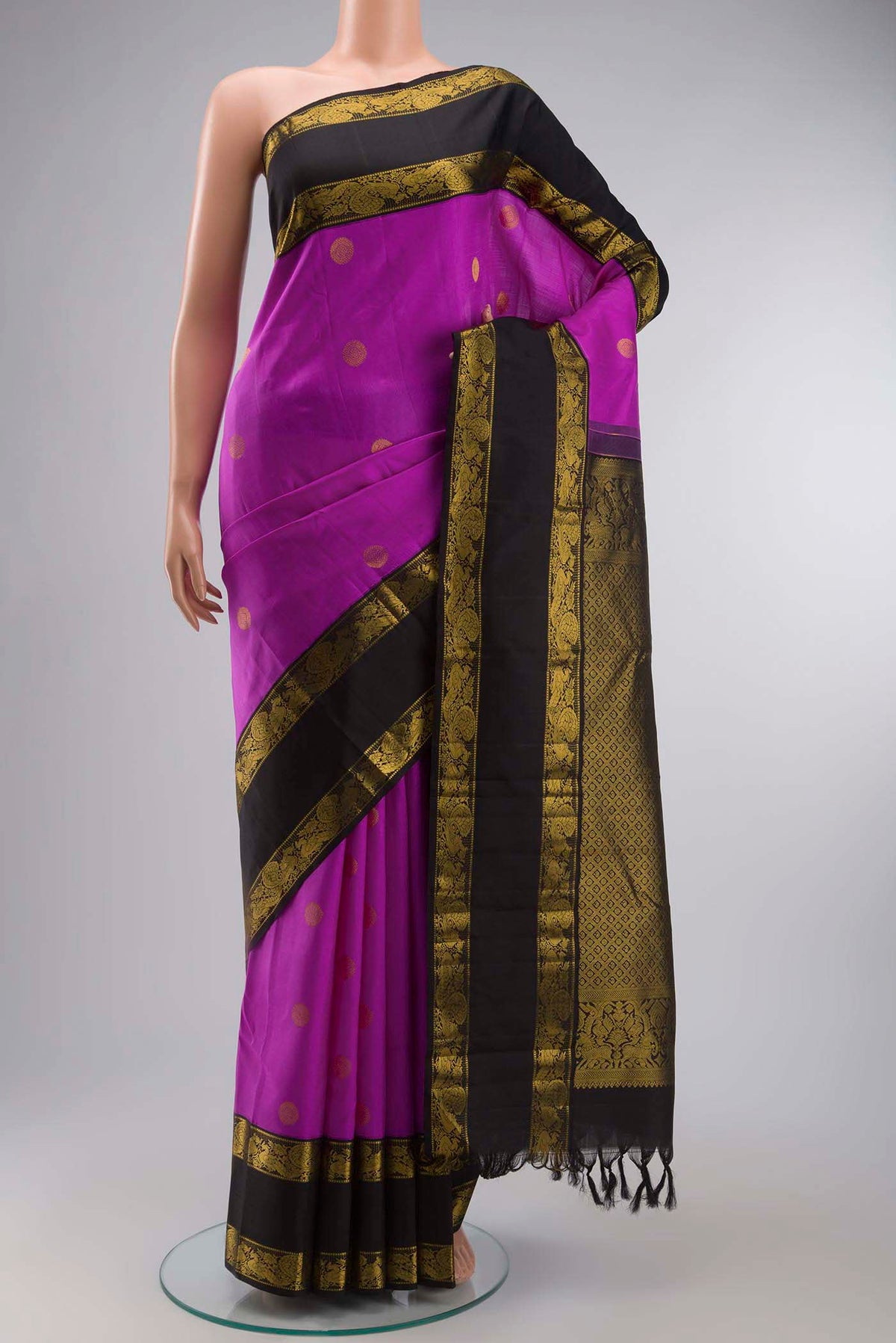 Violet Kanchipuram Silk Saree with Zari Butta on the body and Zari Border displayed on a mannequin