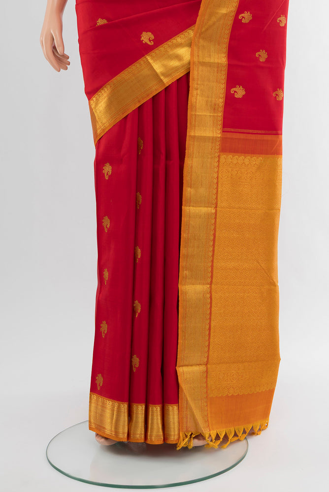 Pleats and pallu of Pure Silk Pure Zari Red Kanjivaram Saree with Zari Butta on the body and Silk Border. 