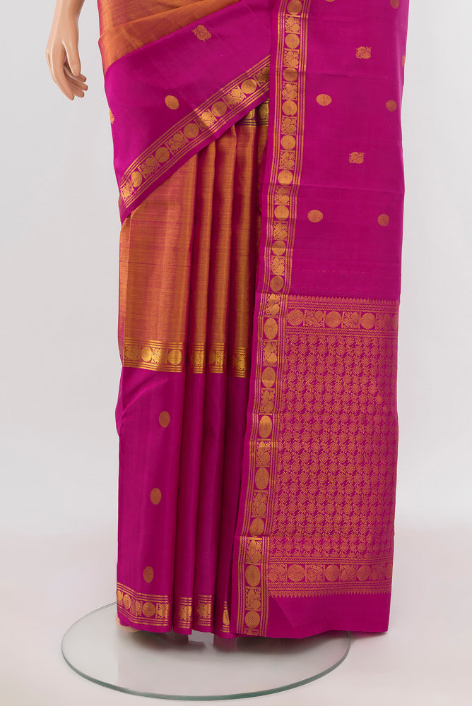 Pleats and pallu of Golden Kanjivaram Silk Saree with Zari Butta on the body and Silk Border. 