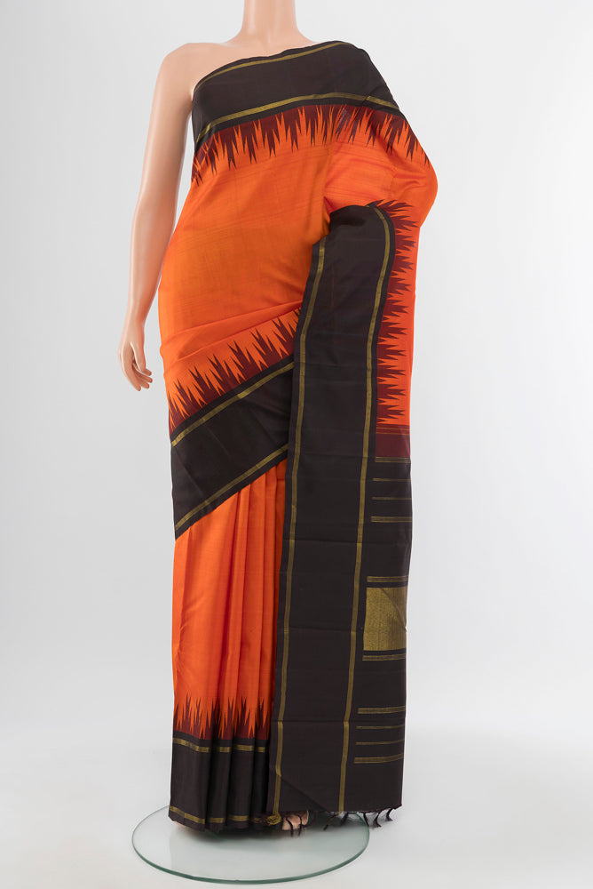 Orange Kanchipuram Silk Saree with Zari Butta on the body and Silk Border.  displayed on a mannequin