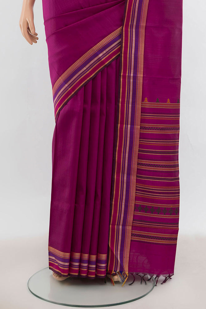 Pleats and pallu of Purple Kanchipuram Silk Saree with Zari Butta on the body and Silk Border. 