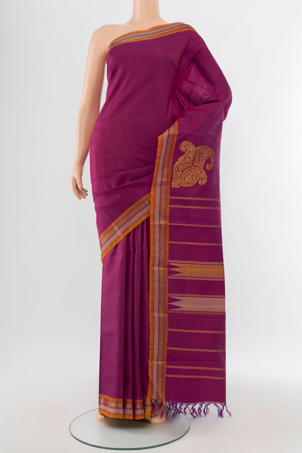 Purple Kanchipuram Silk Saree with Zari Butta on the body and Silk Border.  displayed on a mannequin