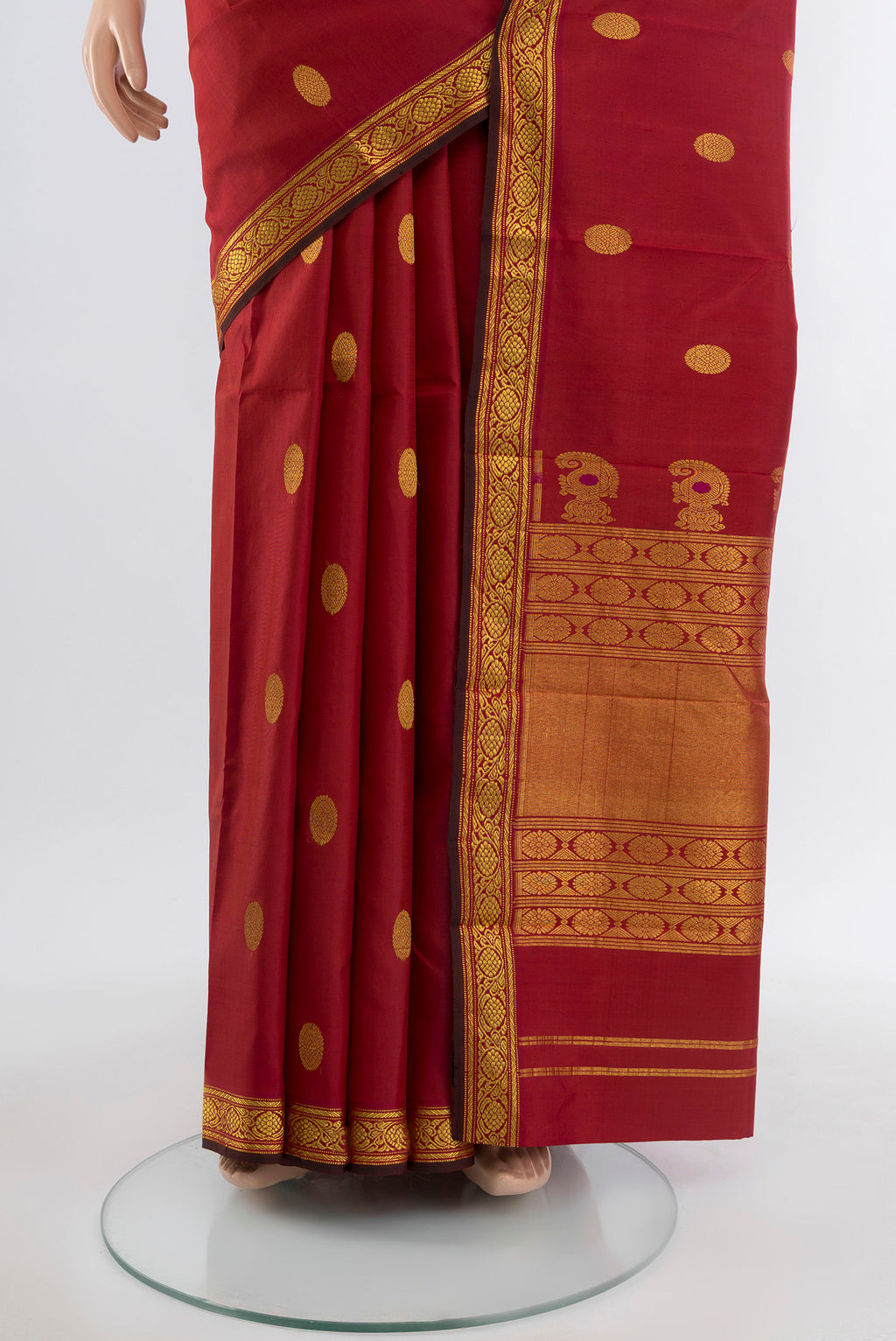 Pleats and pallu of Maroon Kanjivaram Silk Saree with Zari Butta on the body and Silk Border. 