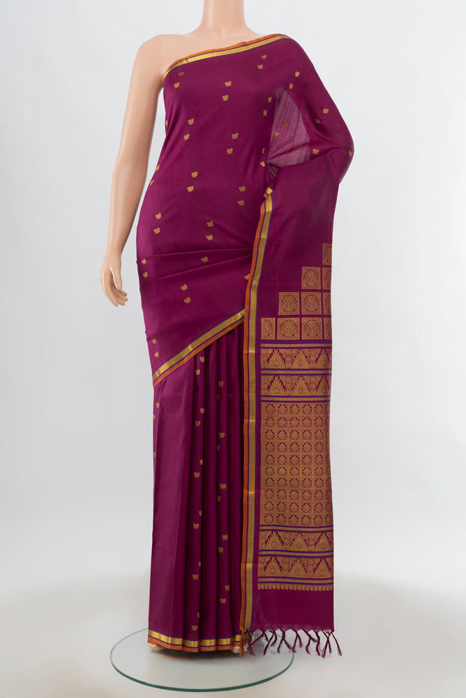 Purple Kanjivaram Silk Saree with Zari Butta on the body and Silk Border.  displayed on a mannequin