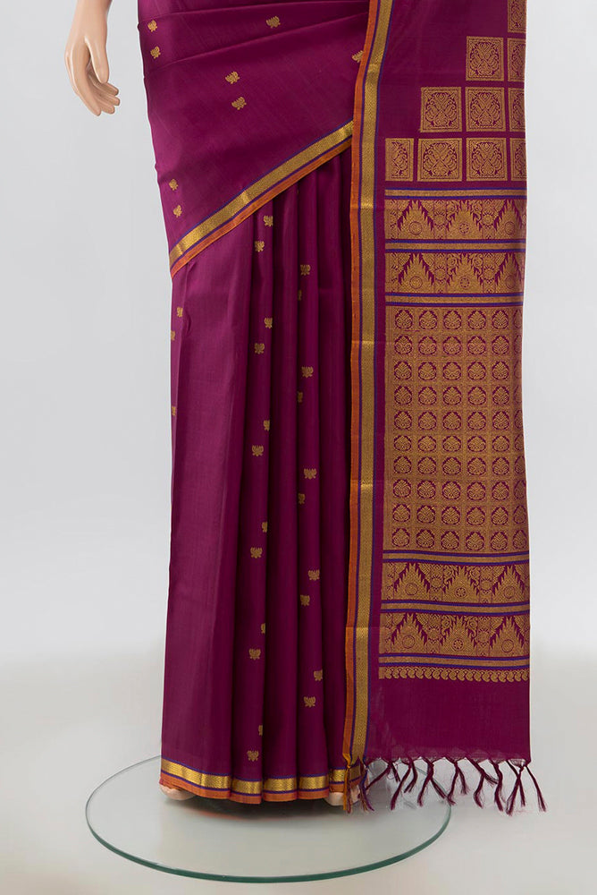 Pleats and pallu of Purple Kanjivaram Silk Saree with Zari Butta on the body and Silk Border. 