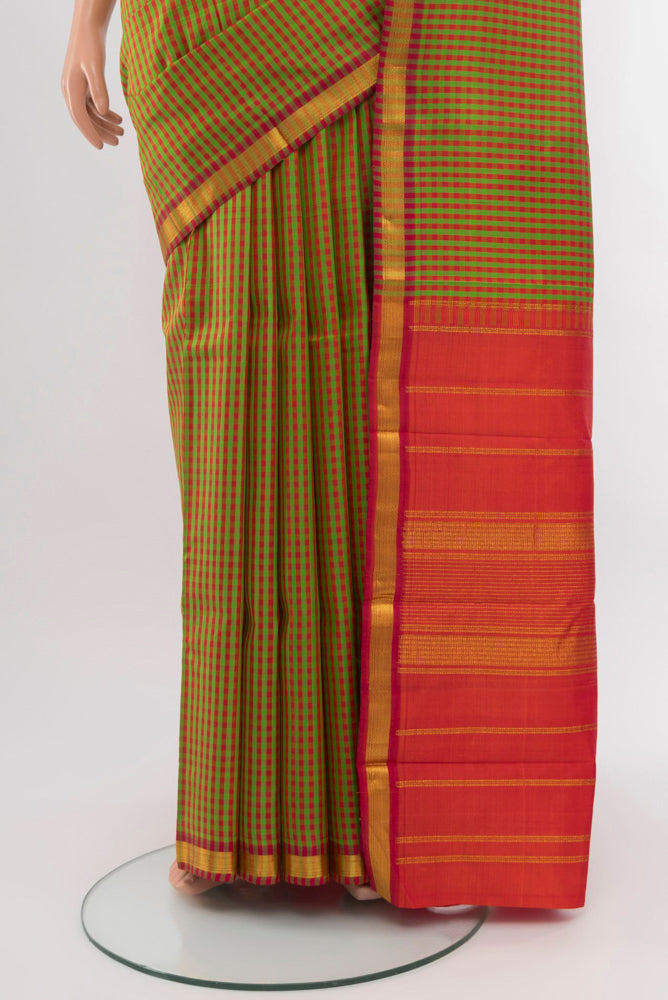 Pleats and pallu of Multi Color Kanchipuram Silk Saree with Checked design on the body and Silk Border. 