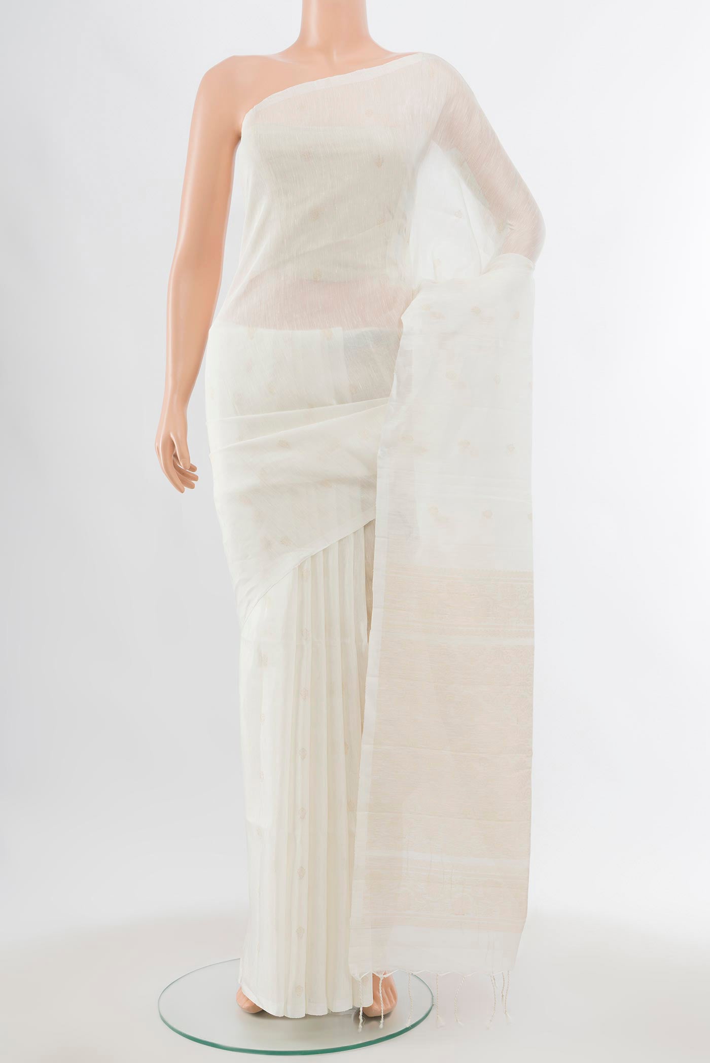 White Soft Silk Saree with Zari Butta on the body and Without Border displayed on a mannequin