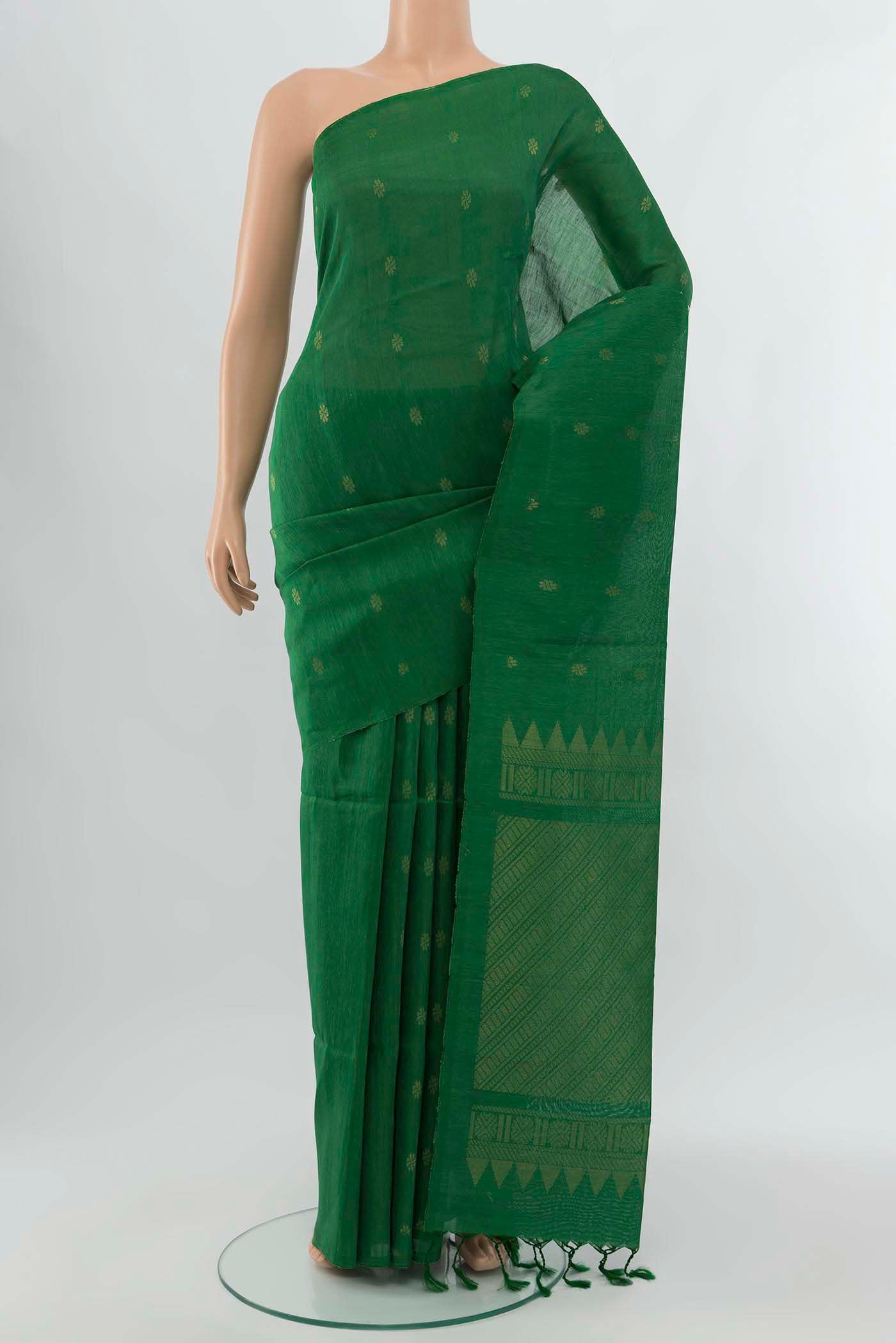 Light Green Soft Silk Saree with Zari Brocade on the body and Silk Border displayed on a mannequin