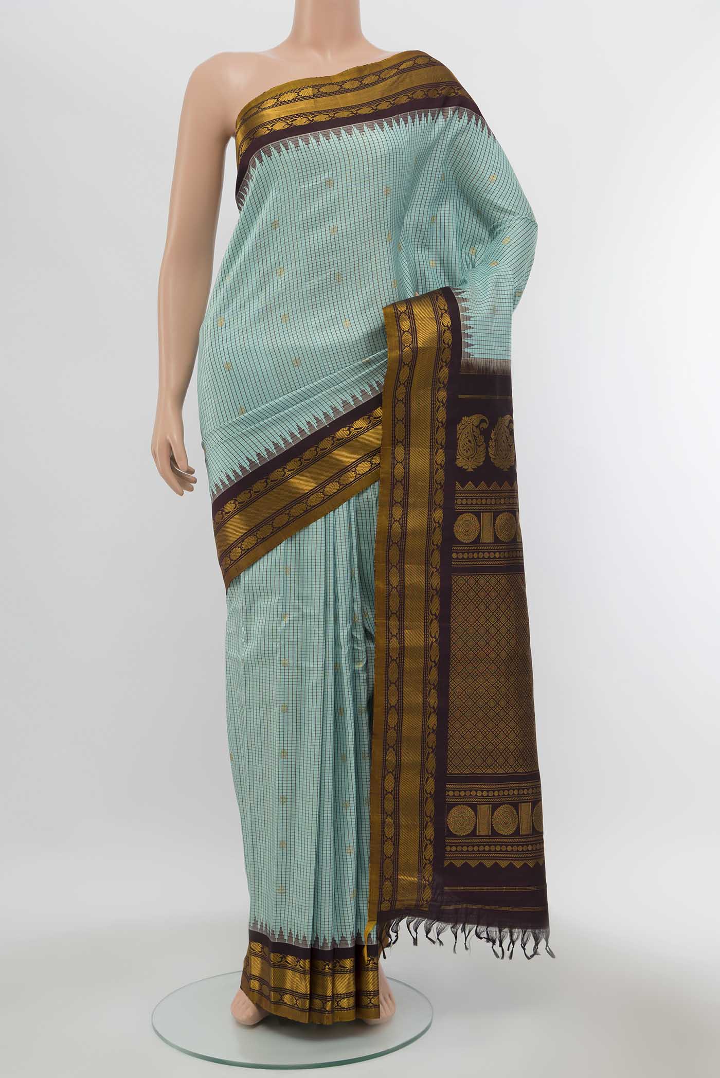 Sky Blue Gadwal Silk Saree with Zari Butta on the body and Zari Border displayed on a mannequin