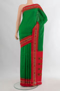 Pure Silk Green Pochampally Saree with Pure Ikat on the body and Ikat Border.  displayed on a mannequin