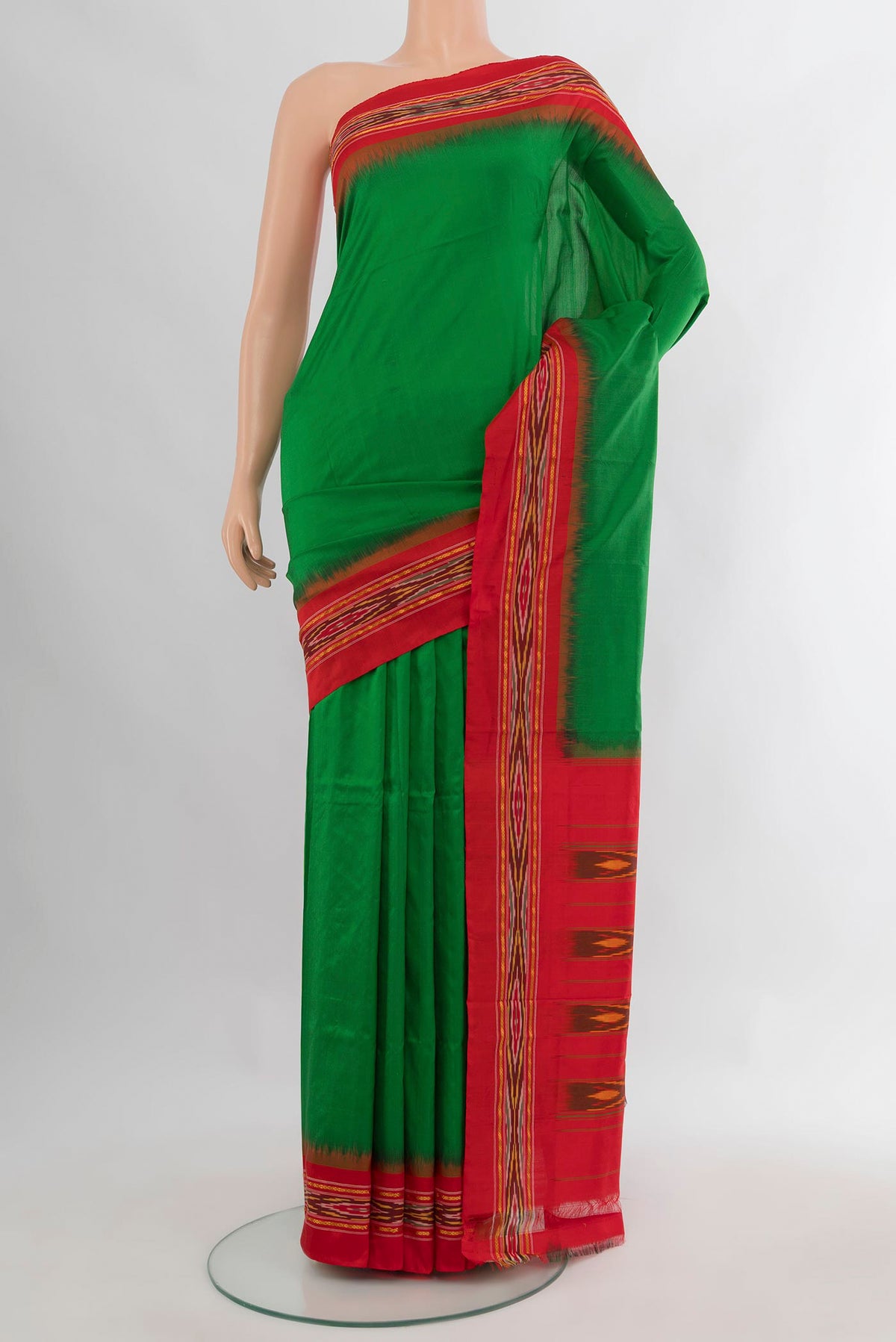 Pure Silk Green Pochampally Saree with Pure Ikat on the body and Ikat Border.  displayed on a mannequin