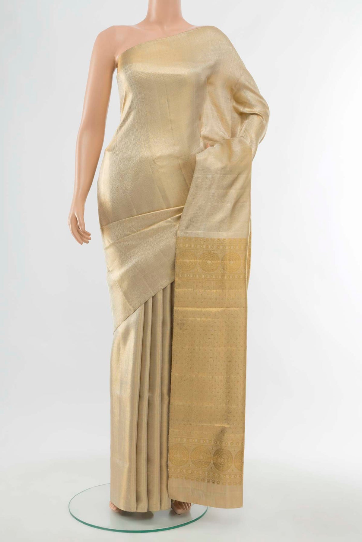 Golden Kanchipuram Silk Saree with Zari Butta on the body and Silk Border displayed on a mannequin
