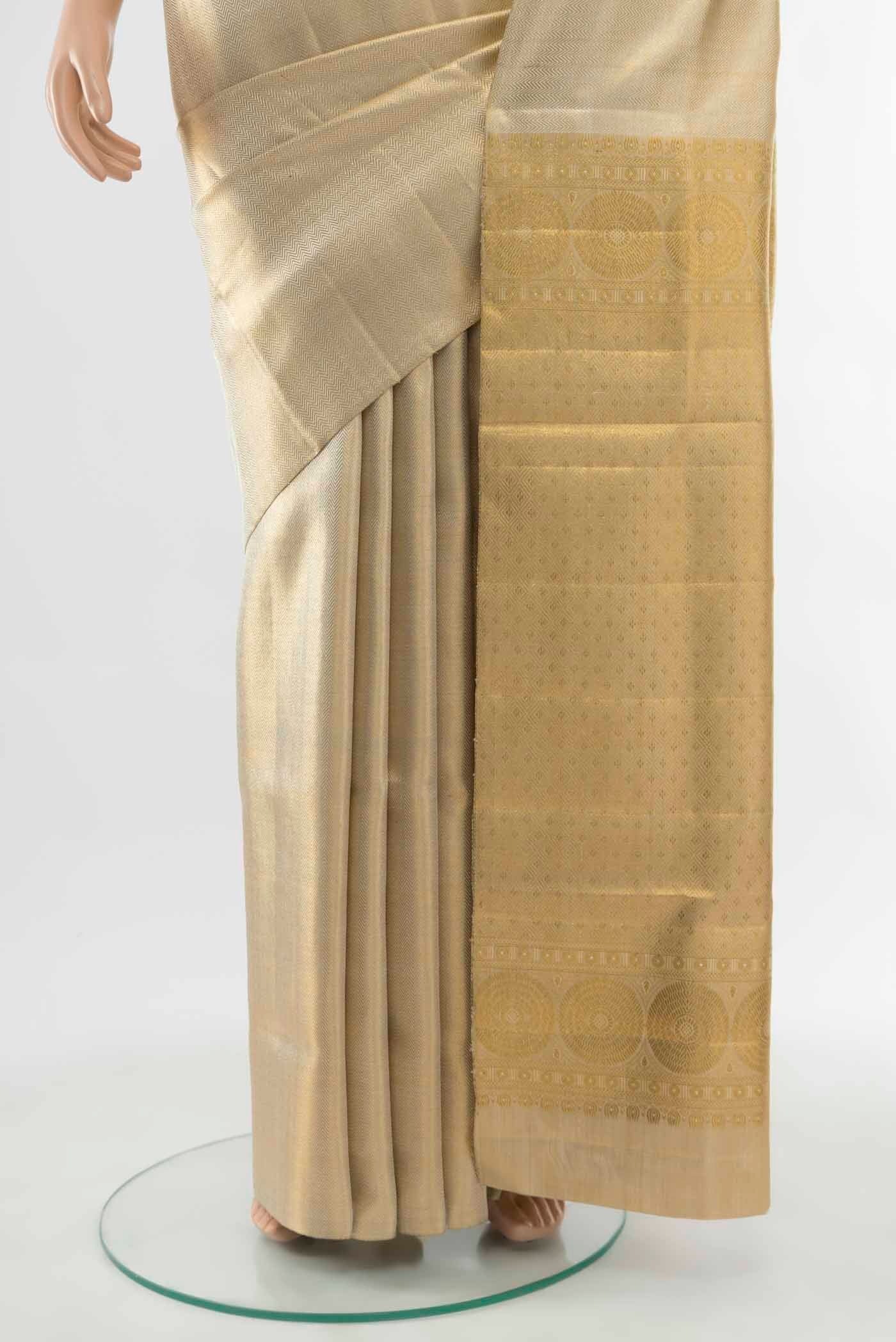 Pleats and pallu of Golden Kanchipuram Silk Saree with Zari Butta on the body and Silk Border