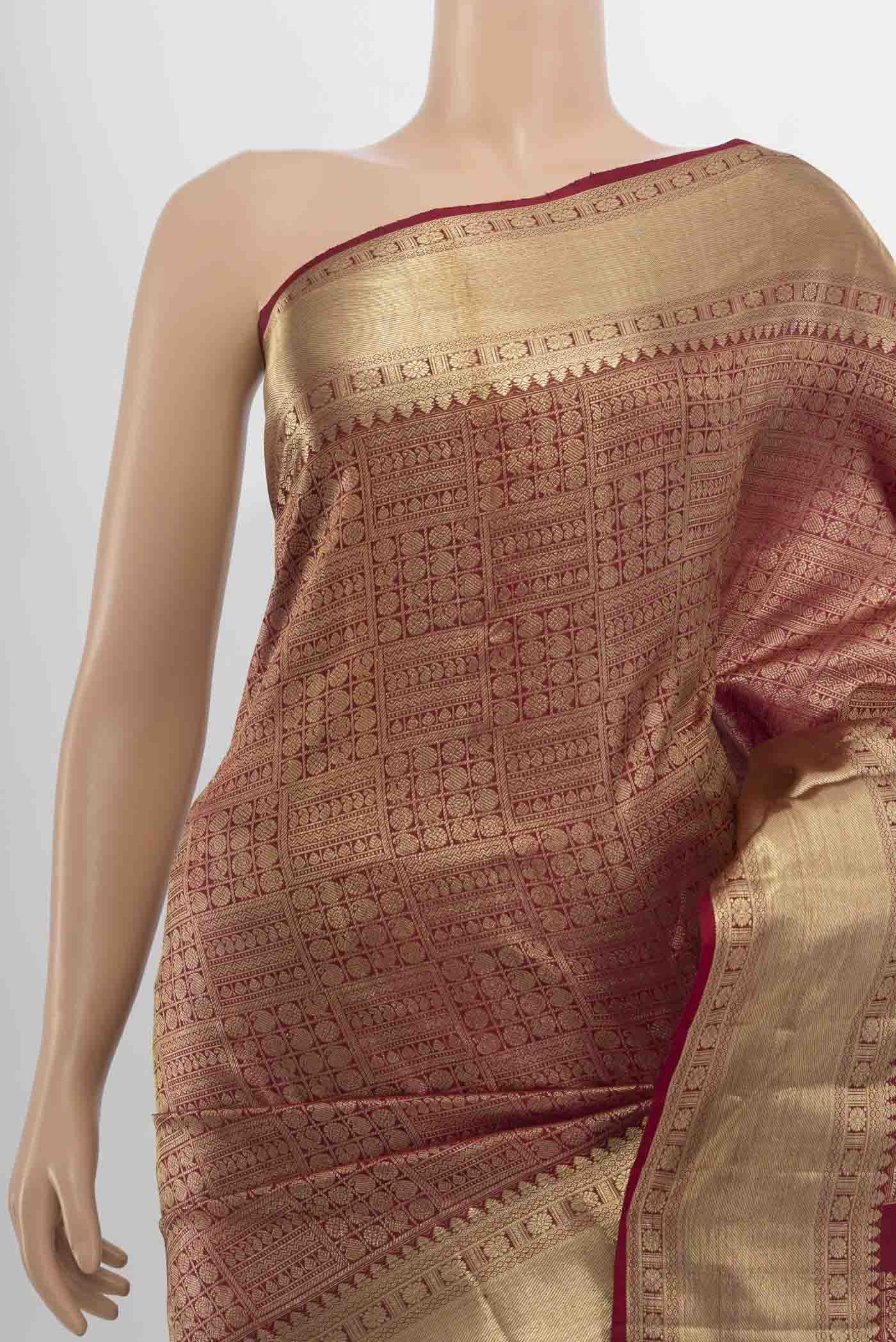 Border image of Maroon Kanchipuram Silk Saree with Zari Butta on the body and Silk Border. 