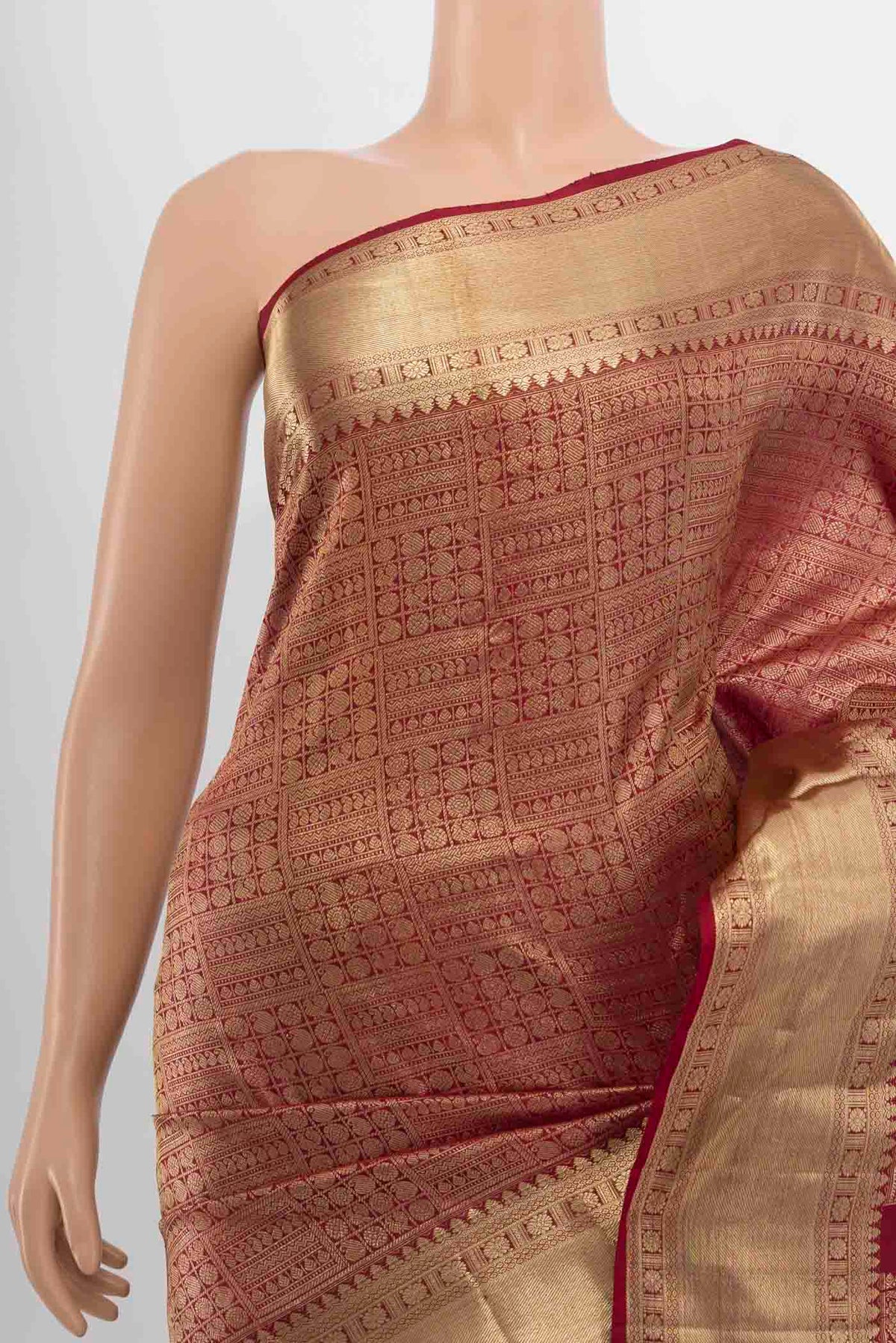 Border image of Maroon Kanchipuram Silk Saree with Zari Butta on the body and Silk Border. 