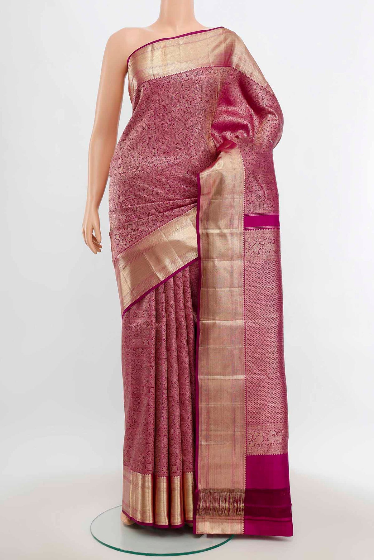 Purple Kanchipuram Silk Saree with Zari Butta on the body and Silk Border.  displayed on a mannequin