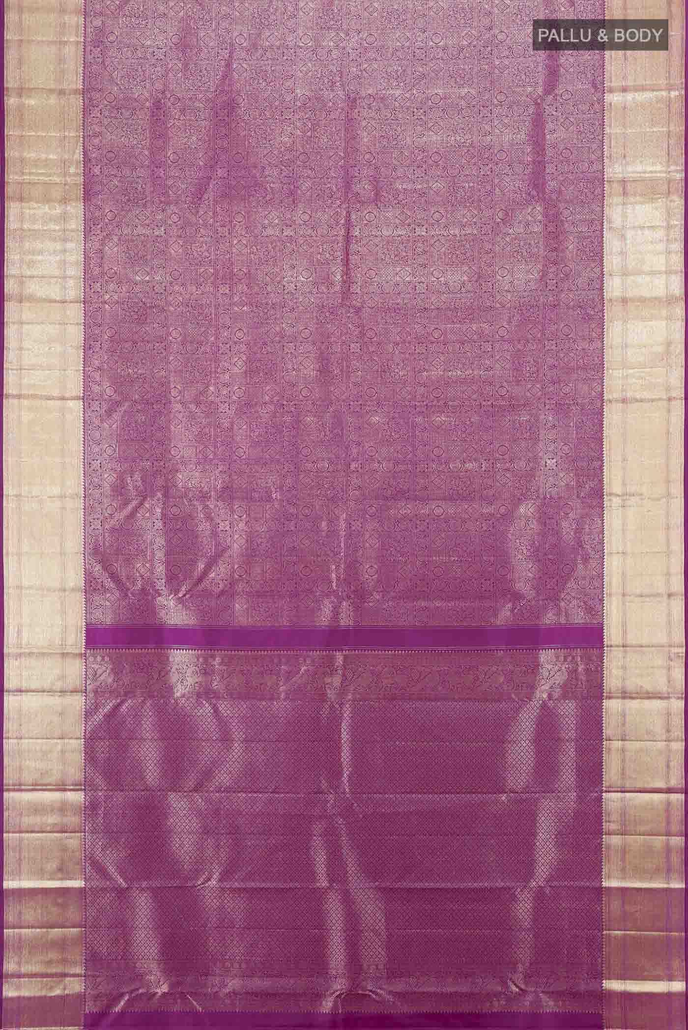Flat view of Purple Kanchipuram Silk Saree with Zari Butta on the body and Silk Border. 