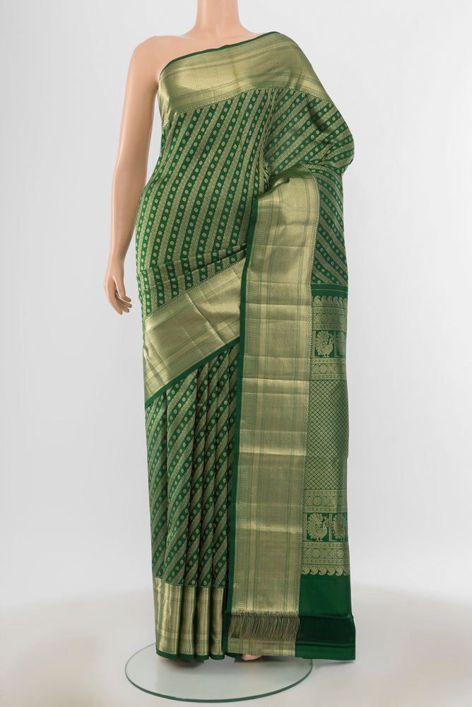 Pure Silk Pure Zari Mint Green Kanchipuram Saree with Zari Butta on the body and Silk Border.  displayed on a mannequin