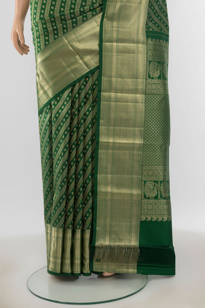 Pleats and pallu of Pure Silk Pure Zari Mint Green Kanchipuram Saree with Zari Butta on the body and Silk Border. 