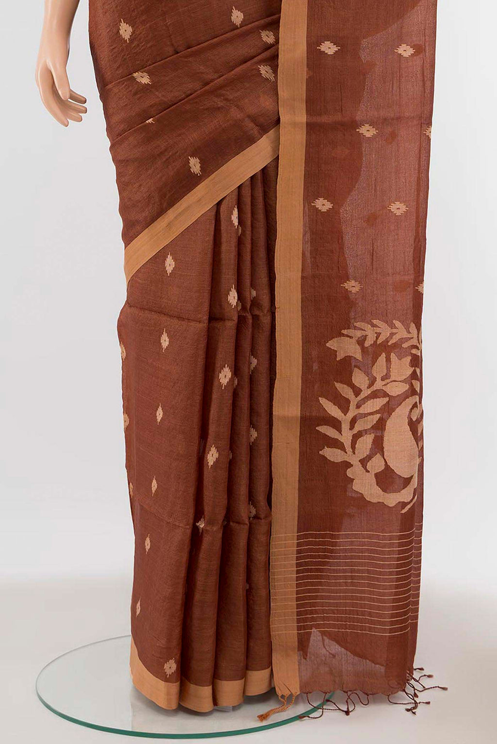 Pleats and pallu of Brown Tussar Silk Saree with Thread Butta on the body and Thread Border